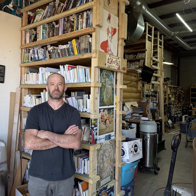Josh Eldred, founder of Abq Reclaimed, standing in his Albuquerque reuse warehouse